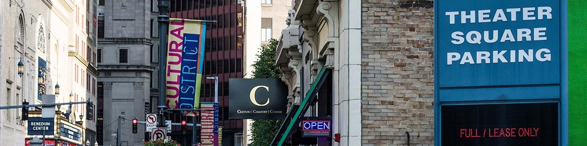 a parking garage sign outside of theater square garage