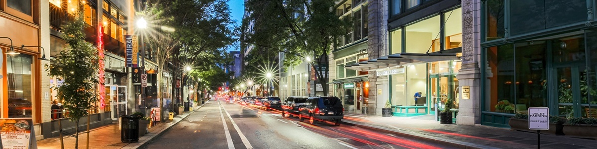 a busy downtown pittsburgh street at night