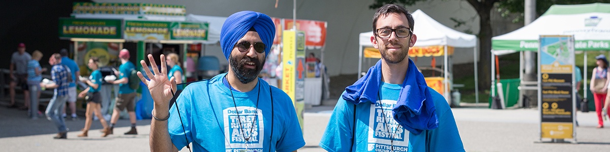 two three rivers arts festival volunteers standing in point state park