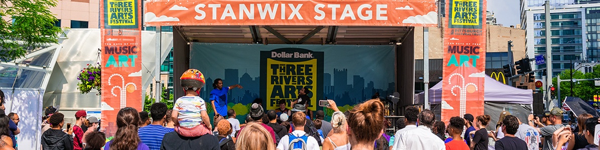 a crowd watches performers on the stanwix stage