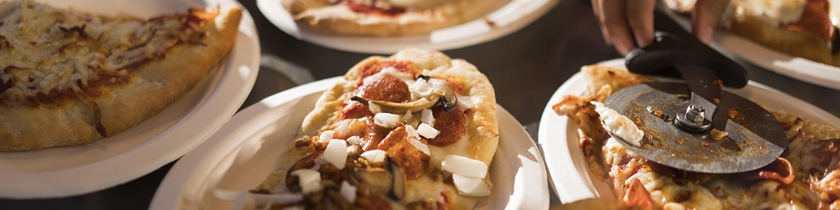 freshly-made pizzas sit ready for festival visitors