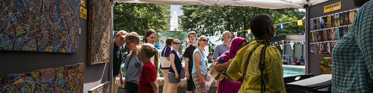 visitors browse the artist market
